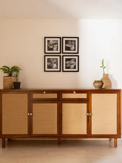This custom foyer unit was designed to meet a client's specific storage needs, with dedicated space for footwear, umbrellas, keys, and sports equipment. It proves that practical furniture can also be beautiful.