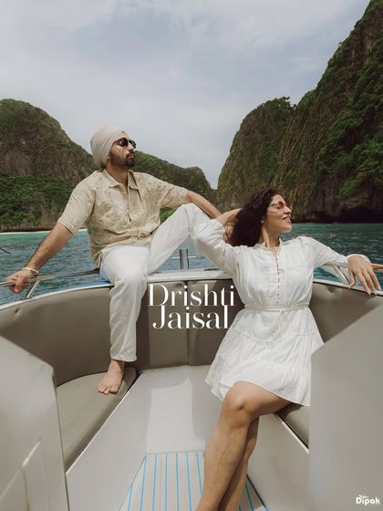 A relaxed and stylish shot of a couple on a speedboat in Thailand. I focus on capturing both epic and candid moments that reflect your personality during your destination shoot.
