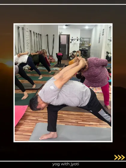 A student holds a bound side angle pose, a powerful standing pose that strengthens the legs and opens the chest.