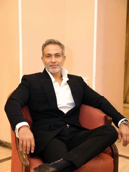 A seated portrait, reflecting a moment of composed confidence. As a trial lawyer, maintaining composure under pressure is a critical skill I have honed over 25 years.