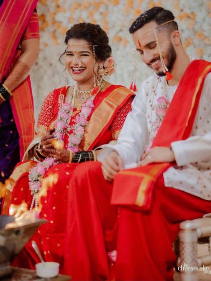 Laughter and joy during the ceremony. Her hairstyle remains perfectly in place, allowing her to enjoy every moment.