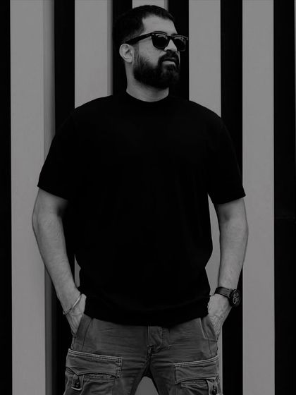 A strong, posed black and white portrait.