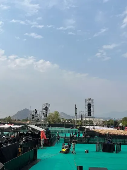 This wide shot of the Harris Jayraj concert setup in Salem showcases the scale of my operations. I managed the entire venue construction, including the massive stage, sound towers, and ground-level green turf, transforming an open field into a concert arena.