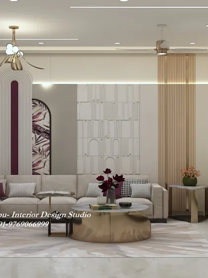 This living room at Oxy Beaumonde, Pune, features a stunning wall with multiple textures, including fluting, 3D panels, and a niche with floral wallpaper. The design is rich, layered, and luxurious.