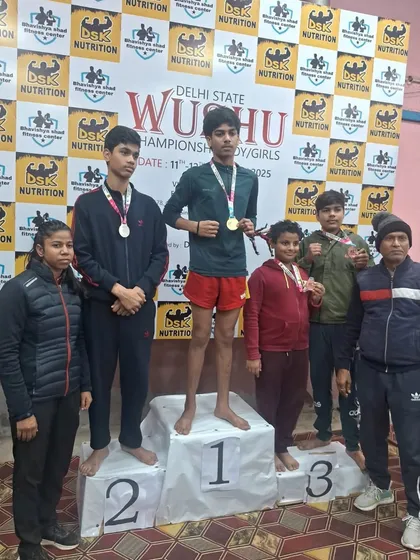 Hard work pays off. Our team proudly displaying their medals after competing in the Delhi State Wushu Championship. We don't just train, we build champions who know how to win.