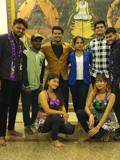 A post-show group photo with our dancers in their colorful, sequined performance outfits. The energy and passion of our team shines through in every event.