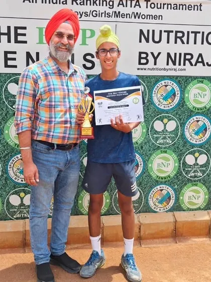Gurrshan Mehta with his father and his winner's trophy. The journey of a junior player is a team effort.