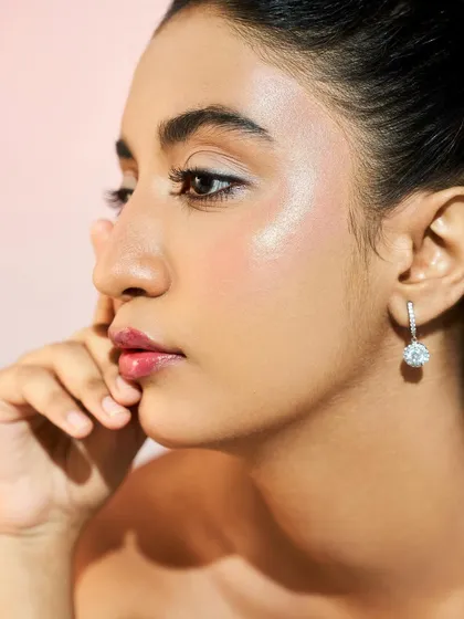 A profile view highlighting the subtle contour and glow on the cheeks. This technique adds dimension to the face without looking heavy.