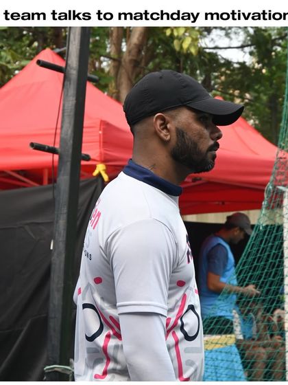A coach observing a match, ready to provide motivation and guidance. Our coaches are our players' biggest supporters.