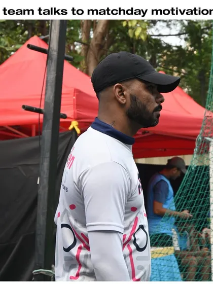 A coach observing a match, ready to provide motivation and guidance. Our coaches are our players' biggest supporters.