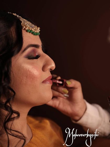 Duplicate of 19. The final touch of lipstick completes the look, bringing everything together.