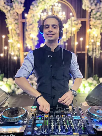 A euphoric feeling when the music is playing and the decor is perfect. This beautiful setup with a wall of lights was the backdrop for a great night.