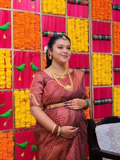 A beautiful, happy portrait from her baby shower. The makeup is designed to look fresh and natural, perfect for celebrating this special milestone.
