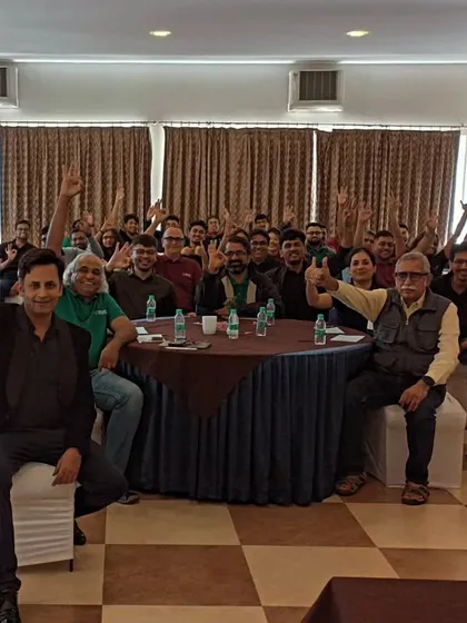 A happy group photo after my performance at an offsite event. The thumbs-up from the audience is the best review an artist can get.