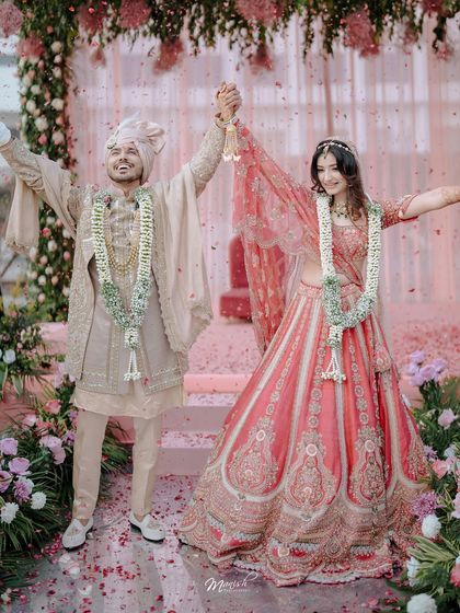 A moment of pure celebration as the newlyweds are showered with petals. We capture the energy and joy that fills the air right after the wedding ceremony.