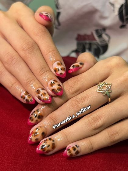 A fierce and fabulous take on a French manicure. I combined a classic leopard print with bold, hot pink tips for a look that is wild and stylish.