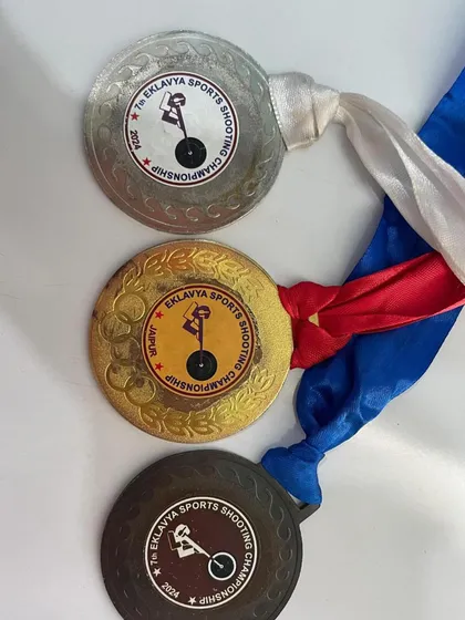 Gold, silver, and bronze medals from the Eklavya Sports Shooting Championship held in Jaipur. Our shooters travel and compete in events across the country.