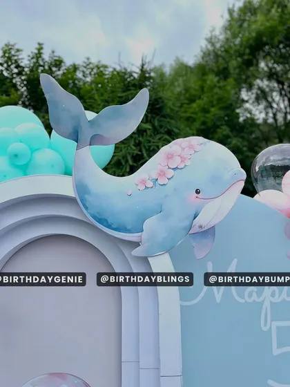 A beautiful whale cutout with floral accents, adding a touch of whimsy to the ocean theme.