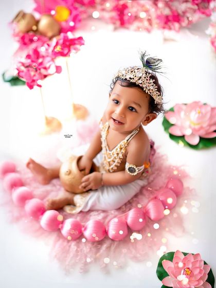 Looking up with innocent eyes, this baby Krishna holds his pot of butter.