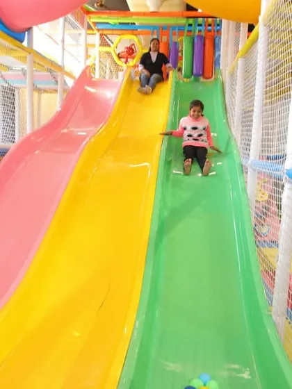 The heart of our indoor fun is this multi-level play structure, complete with colorful slides. Kids love the thrill of racing down, and our soft, padded landing areas ensure their play is always safe.