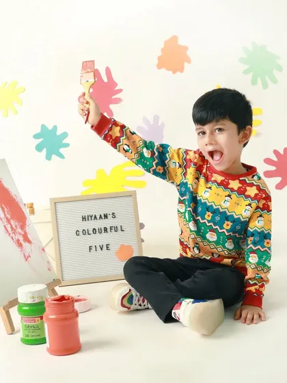 A colorful fifth birthday! This budding artist theme, complete with an easel and paint, was a perfect way to celebrate his creative spirit.