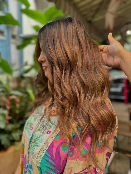 A close-up of the hand-painted highlights. This non-bleach technique allows for a customized and natural-looking result.