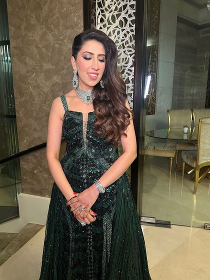 A close-up of the emerald glam, highlighting the shimmery eye and the flawless, glowing skin.