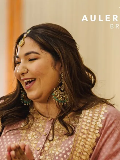A close-up of Shubhi's radiant smile. The delicate headpiece and beautifully crafted earrings were the perfect complement to her pre-wedding look, reflecting her joyful spirit.