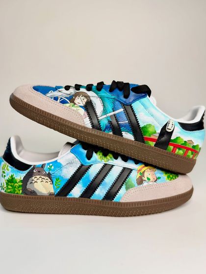 Here's a pair of custom Adidas Sambas I painted for a Studio Ghibli fan. The design features scenes and characters from multiple films, including My Neighbor Totoro and Spirited Away, against a dreamy sky.