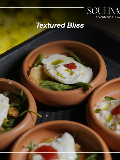Textured bliss in a terracotta bowl, featuring creamy burrata with a hint of spice. A simple dish transformed into a gourmet experience.
