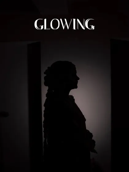 A stunning silhouette of the bride, creating a mysterious and artistic portrait. This is a unique way to capture the bridal form.