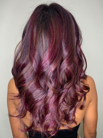 Spice up your look with a mix of purple and pink hues. This is a great example of a creative colour service, where we blend different tones for a unique, multi-dimensional result.