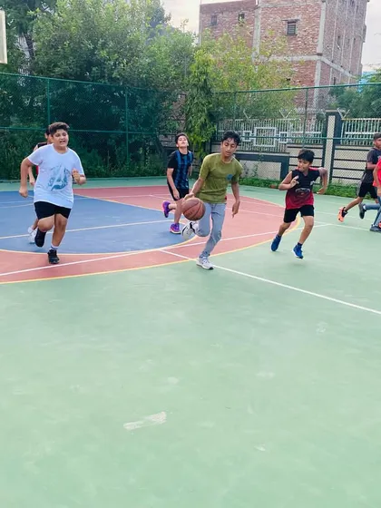A player dribbles the ball down the court.