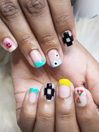 Some funky nail art for a client who wanted something fun and different. This set includes a smiley face, checkerboard, and tiny tulips.
