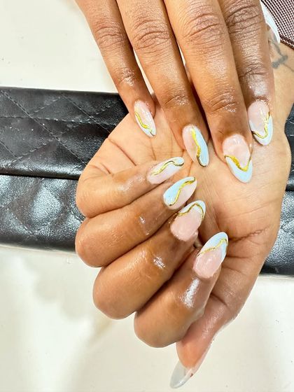 A modern and artistic design with light blue and gold abstract swirls on a nude base.