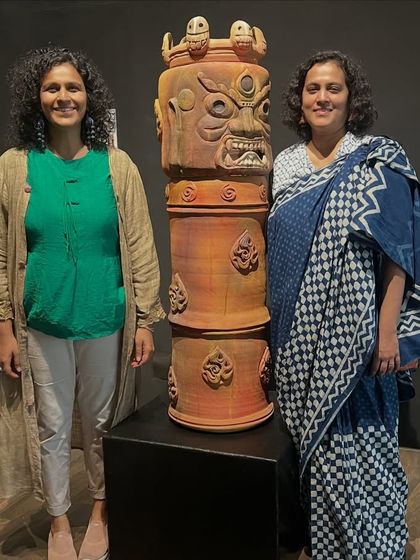 With my sister beside the 'Navrasa Stambh'. This large, coiled and carved terracotta piece is a culmination of community effort and decades of learning.
