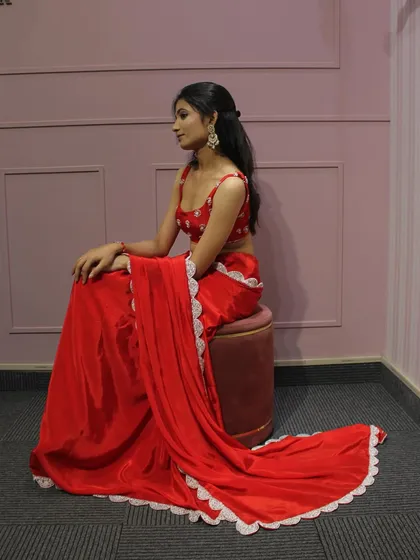 The full look of our red saree, which drapes beautifully and is perfect for any festive occasion.