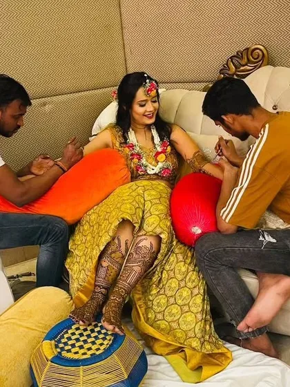 My team and I working together to apply mehndi for a bride. Having multiple artists ensures the process is efficient without compromising on quality.