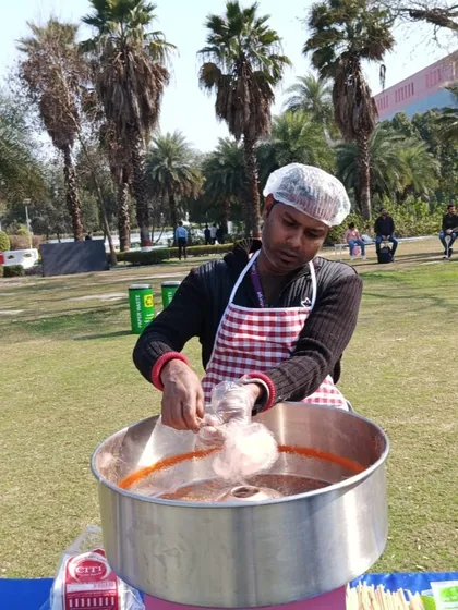 The process of making fluffy cotton candy, a treat that brings smiles to both kids and adults.