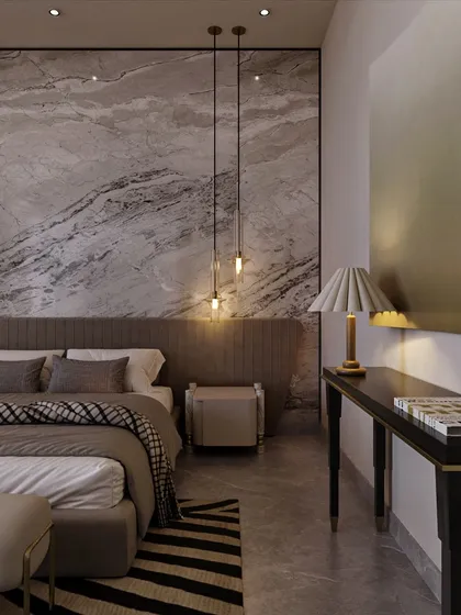Pendant lights hang like jewelry against the marble backdrop, providing soft, ambient light. A sleek console table and modern art piece complete this corner, balancing richness with clean, contemporary lines.