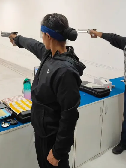 Two shooters practice side-by-side at our Delhi range. Our facilities accommodate multiple athletes, creating a dynamic training environment where they can learn from each other.