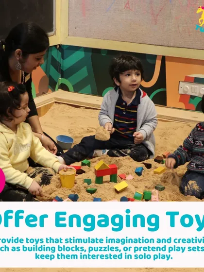 An instructor helps children get started with blocks in the sandpit. We offer engaging toys that stimulate imagination for both solo and group play.