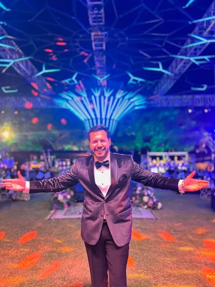 Arms outstretched, welcoming everyone to a grand celebration. The scale of this event was massive, and my energy matched it.