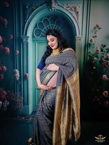 This image is identical to 131, capturing that special bond between a mother and her unborn child in a traditional and artistic setting.