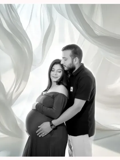 An elegant and artistic studio maternity portrait. For a classic look, I use soft lighting and beautiful backdrops to create timeless images for expecting parents.
