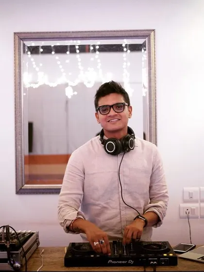 Here I am in my element, behind my Pioneer DJ setup. I believe a great DJ is approachable and focused, ready to read the room and create the perfect atmosphere for any occasion, be it a wedding or a corporate party.