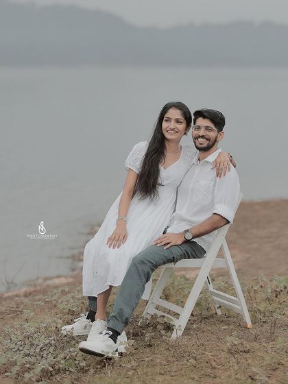 A relaxed and happy portrait by the lake. Using simple props like chairs can add variety to a photoshoot.
