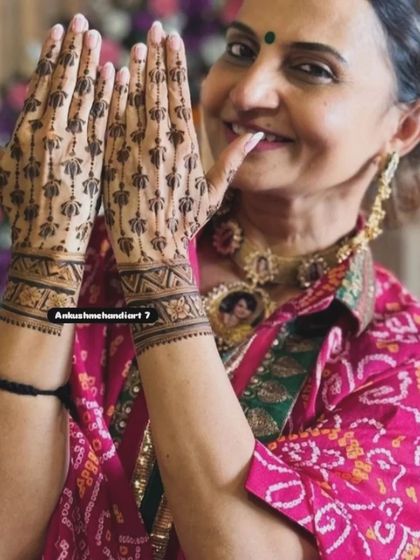 It's not just for brides! A happy client showing off her elegant and simple lotus-stem mehandi, perfect for any festive occasion.