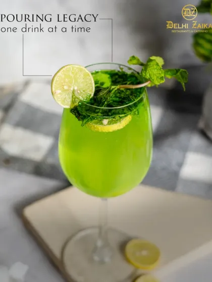 Pouring legacy, one drink at a time. Our handcrafted mocktails, like this vibrant green cooler, elevate your dining experience.