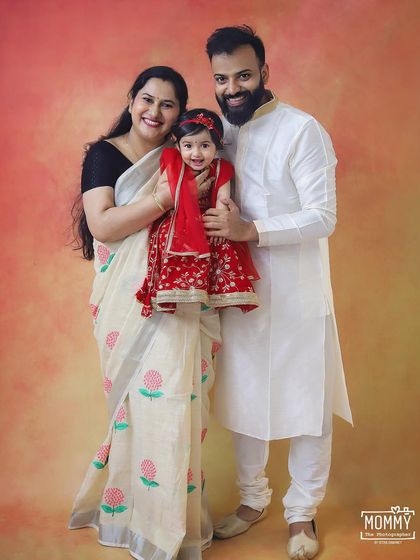 A beautiful family dressed in traditional attire for a Janmashtami themed photoshoot. The little girl dressed as Radha with her parents looks absolutely lovely.